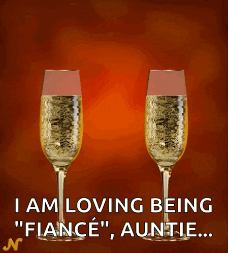 a couple of champagne glasses that say engaged