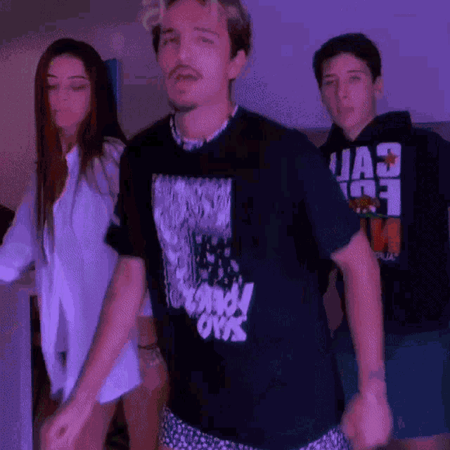 a man wearing a black shirt that says uae on it