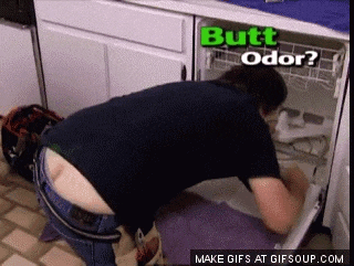 a man is kneeling down in front of a dishwasher that says butt odor on it