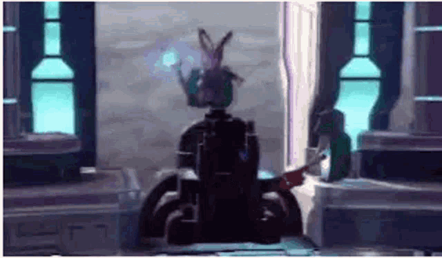 a robot is sitting in a room with a blue light coming out of it .