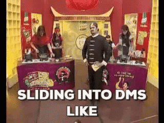 a group of people are standing around a table with the words sliding into dms like