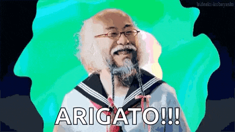 a man with glasses and a beard is wearing a sailor suit and tie and says arigato !!!