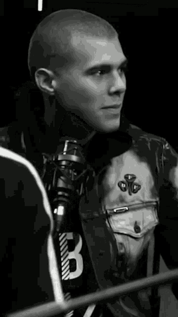 a man wearing a jacket with the number 3 on it