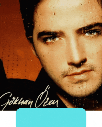 a close up of a man 's face with the name gökhan oren written on the bottom