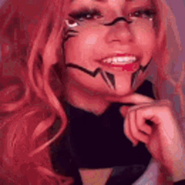 a close up of a woman wearing a pink wig and a black shirt .