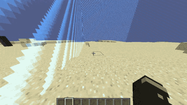 a screenshot of a minecraft game shows a block in the middle of the sand