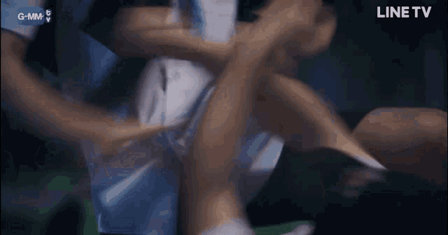 a person is being held by another person with a line tv logo behind them