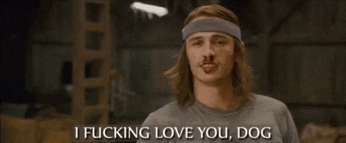 a man with long hair and a headband says i fucking love you dog .