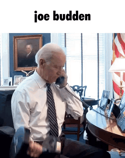 a man in a white shirt and tie is talking on a phone and the caption says joe budden
