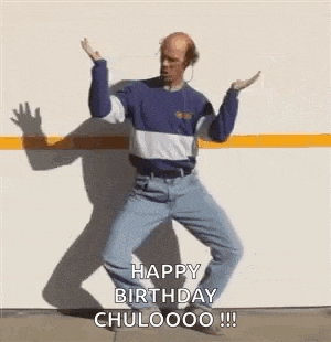 a man is dancing in front of a garage door with the words `` happy birthday chuloooo '' written on the bottom .
