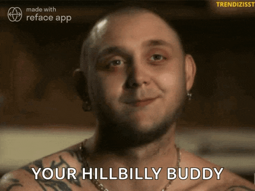 a man with a tattoo on his chest is smiling and says " your hillbilly buddy "