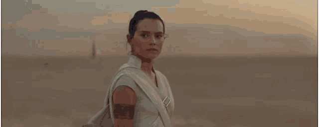 a close up of a woman 's face in a desert .