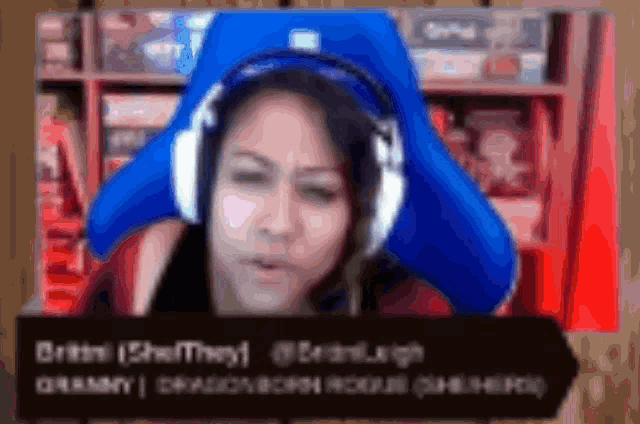 a blurry picture of a woman wearing headphones with the name britni on the bottom