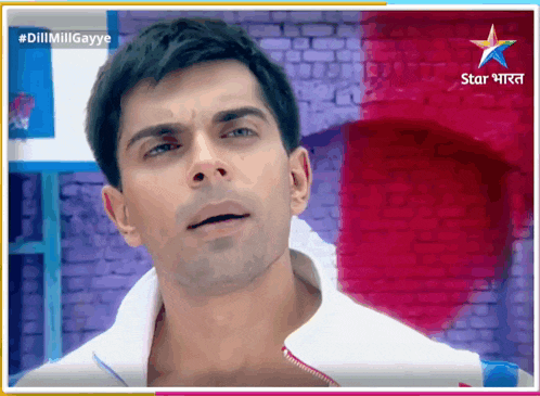 a man 's face is displayed on a screen that says star india