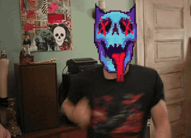 a man wearing a black shirt has a pixelated face on his head