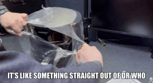 a person is putting something in a plastic bag that says lubricant on it