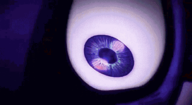 a close up of a cartoon eye with a purple pupil .