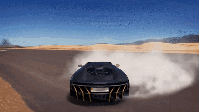 a black sports car with a license plate that says california on it is driving down a desert road