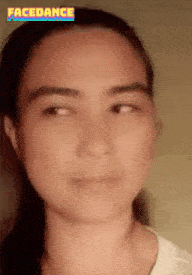 a close up of a woman 's face with the word facedance above her head