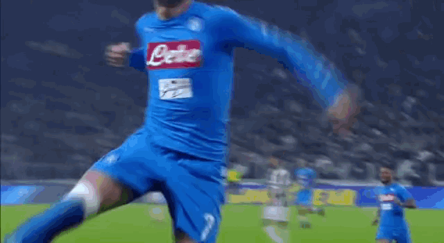 a soccer player wearing a blue jersey that says lete