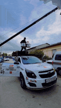 a white car with the license plate s7222kb