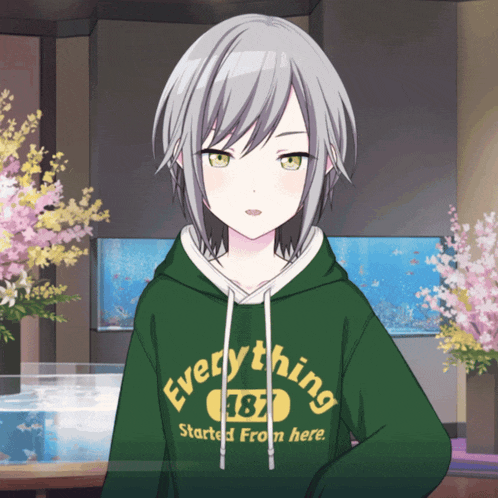 a girl with gray hair wears a green hoodie that says everything started from here