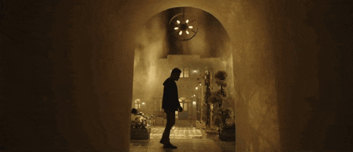 a man in a hoodie is jumping in the air