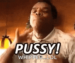 a man is making a funny face and saying `` pussy ! whipped lol '' .