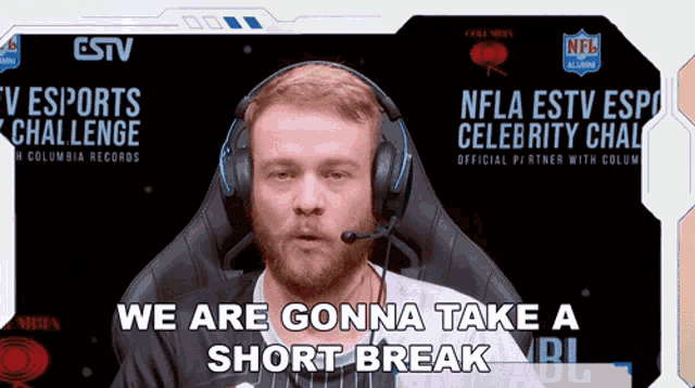 a man wearing headphones with the words we are gonna take a short break