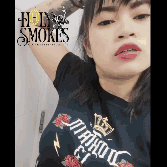 a woman is wearing a shirt that says holy smoke on it
