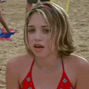 a woman in a red bikini with blue flowers on it