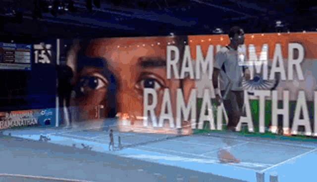a large billboard with a picture of a man and the words ram mar ramanathan