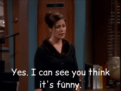 a woman says yes i can see you think it 's funny in front of a door