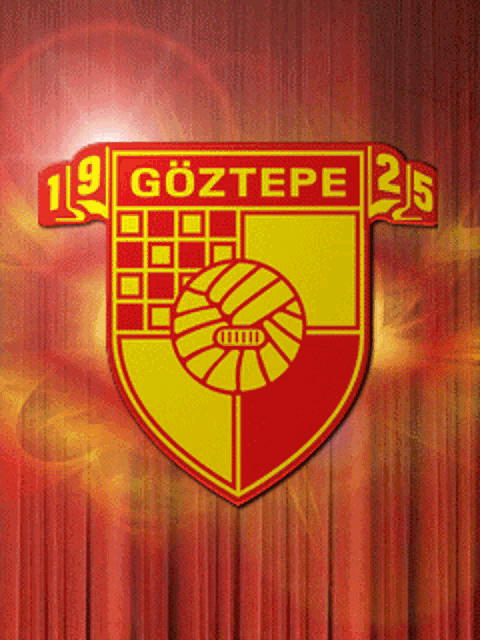 a red and yellow logo for göztepe with a soccer ball in the center