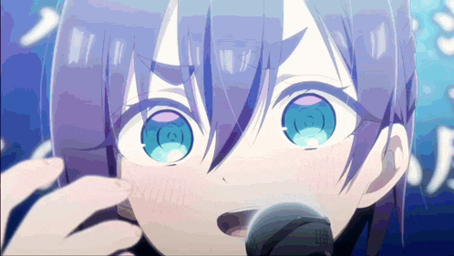 a close up of a person with blue eyes singing into a microphone