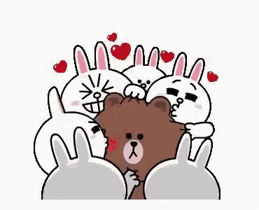 a group of rabbits are hugging a brown bear and kissing him .