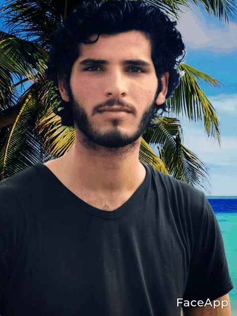 a man with a beard is wearing a black shirt with faceapp on the bottom