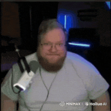 a man with a beard is wearing headphones and a microphone .