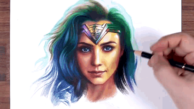 a person is drawing a woman with a crown on her head