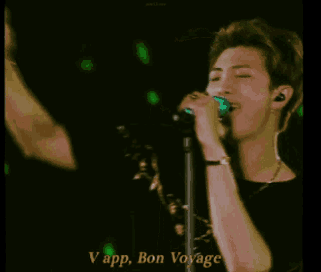 a man singing into a microphone with the words " i know you can 't help what you like " above him