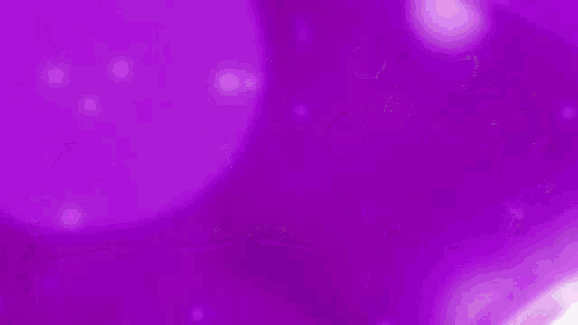 a woman is dancing in front of a purple background with bubbles .