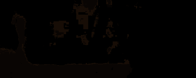 a chain is hanging from a ceiling in a dark room with the sun shining through the fog .