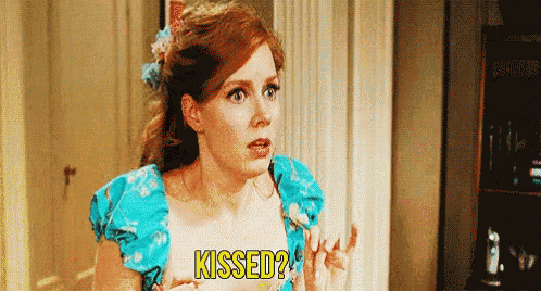 a woman in a blue dress is asking if she kissed .