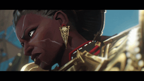 a close up of a woman 's face with a gold triangle earring