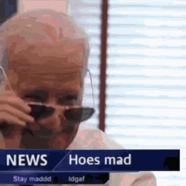a man wearing sunglasses is on a news channel