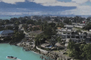 an aerial view of a residential area with a boat in the foreground