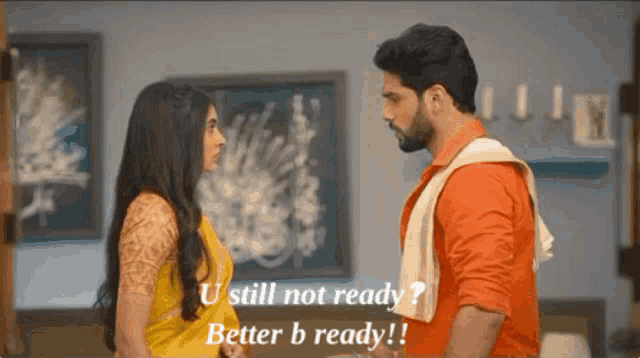a man and a woman are standing next to each other and the man says " u still not ready better b ready ! "