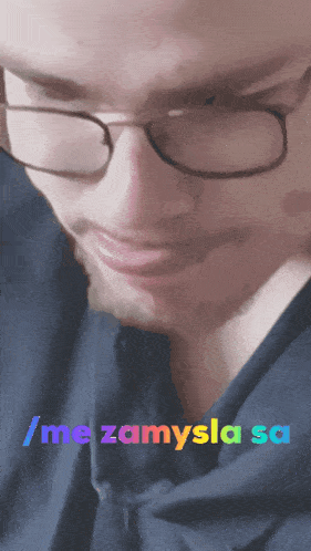 a close up of a man wearing glasses with the words / me zamysla sa written below him