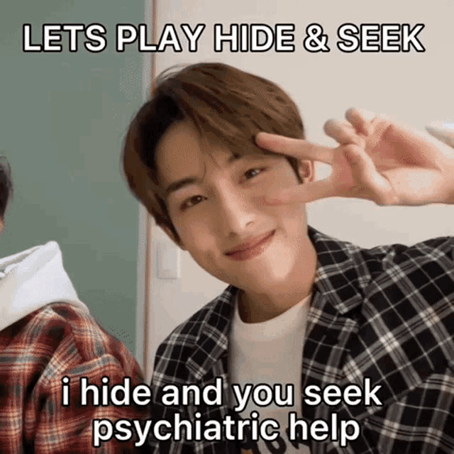 a young man making a peace sign with the words lets play hide & seek
