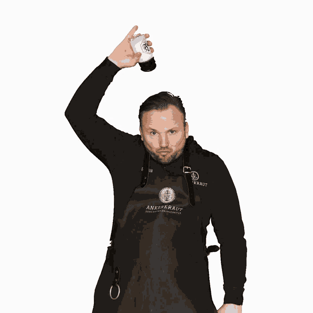 a man wearing a black apron that says ankerkraut